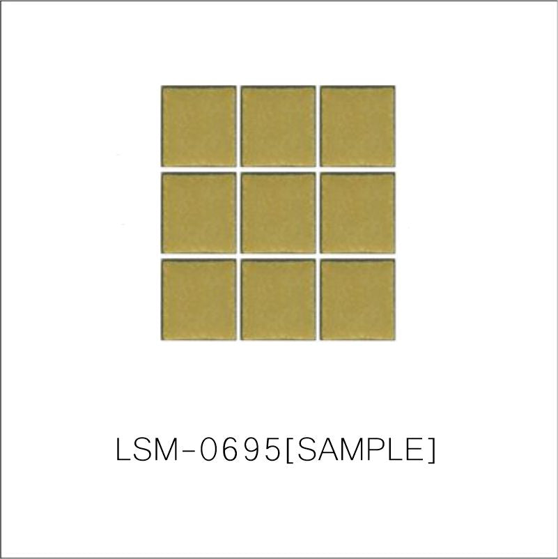 A sheet of square porcelain tiles with a glazed yellow finish, arranged in a mosaic pattern.