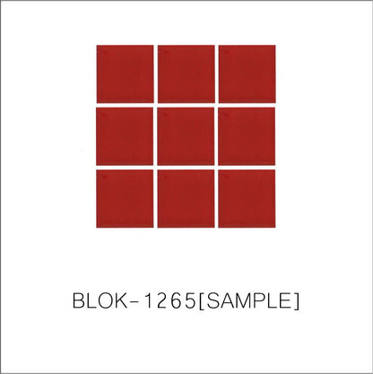 A sheet of square porcelain tiles in red color, arranged in a grid pattern.