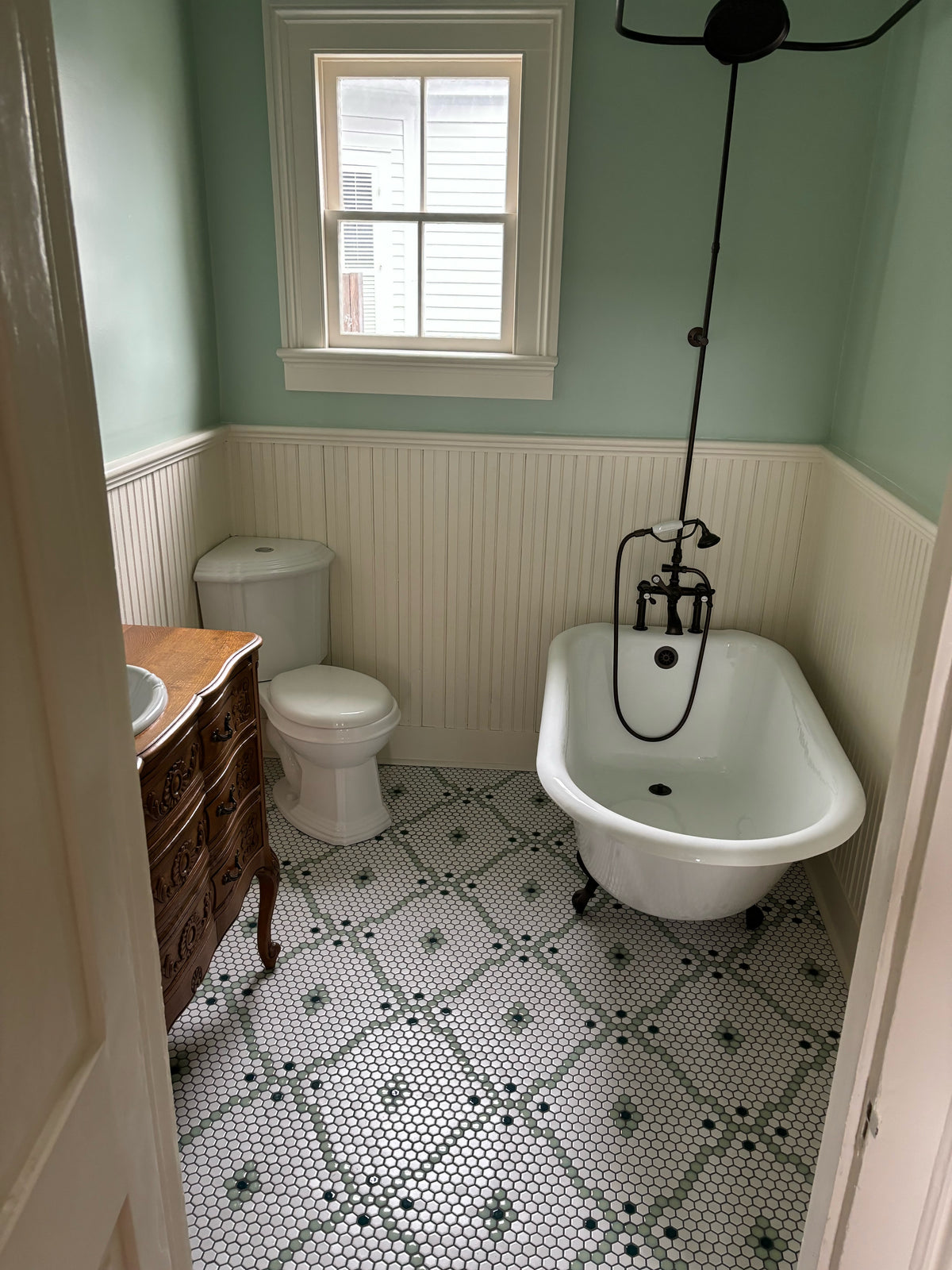 Bathroom at a home with matte modage tile installed on the floor