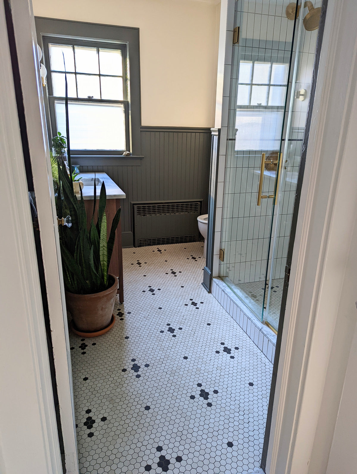 Unglazed Quad & Cross with Dot floor in historic bathroom.
