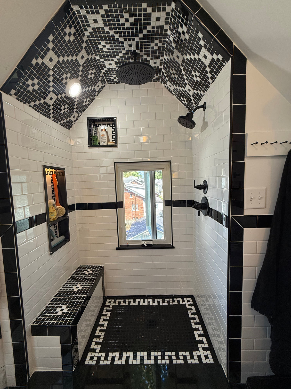 Box & Cross Pattern and Modified Greek Key Step Border for residential shower surround.