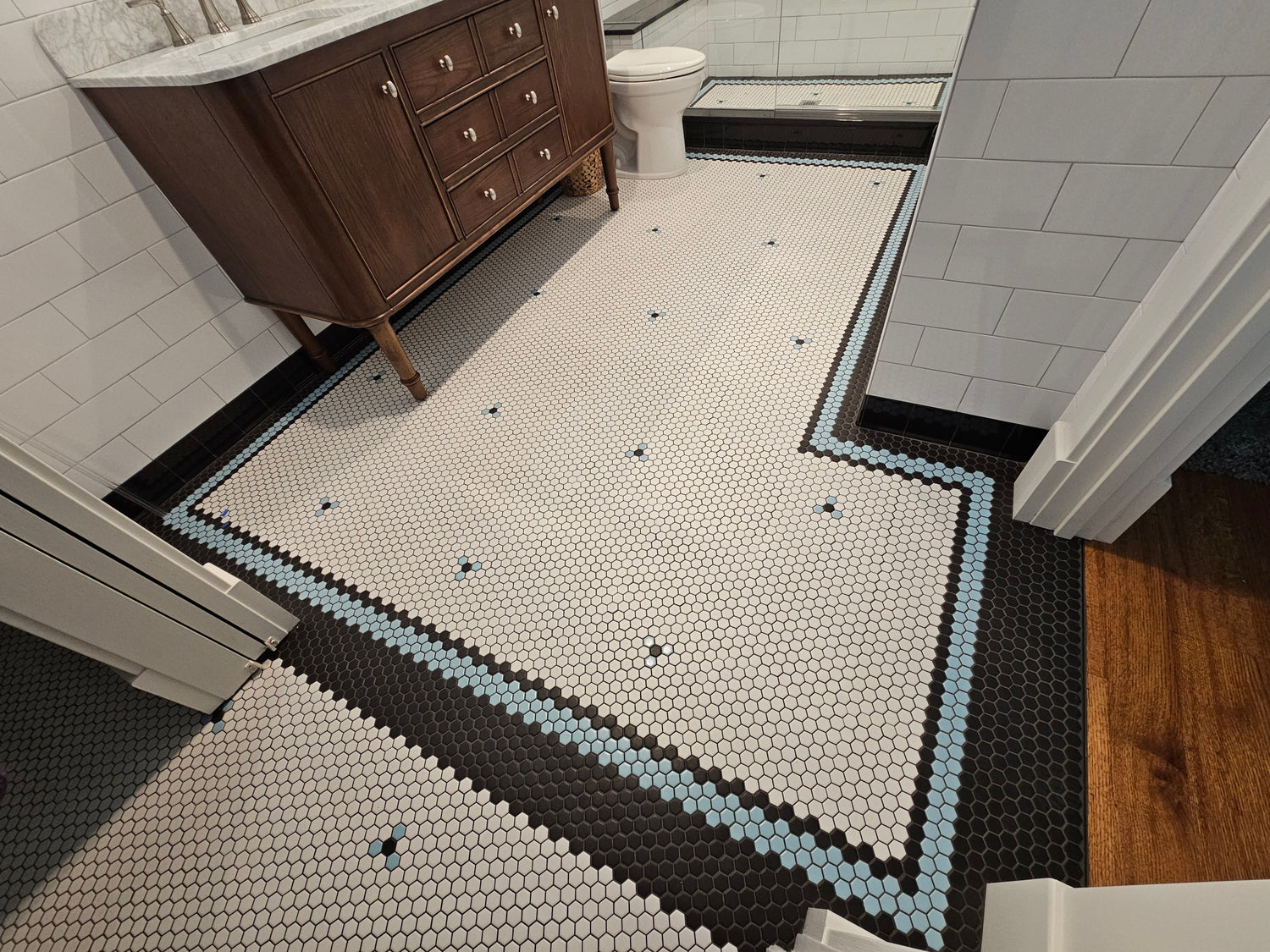 Classic bathroom floor showcasing geometric patterns with Arts and Crafts tiles.
