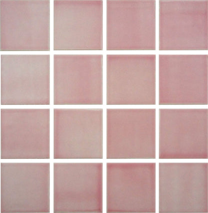 A grid of square glazed porcelain tiles in a light pinkish color.