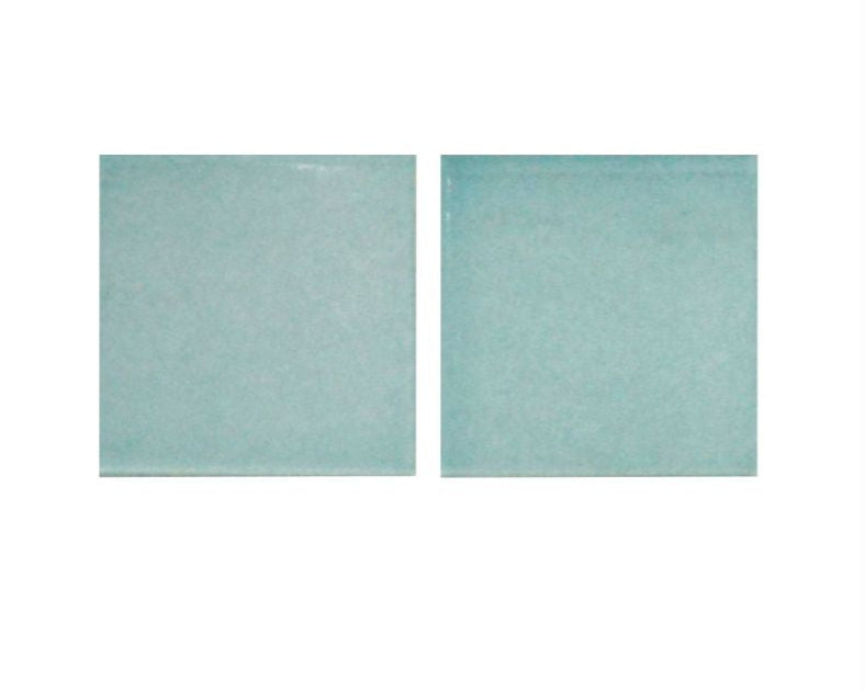 Two square tiles with a subtle pattern on a white background