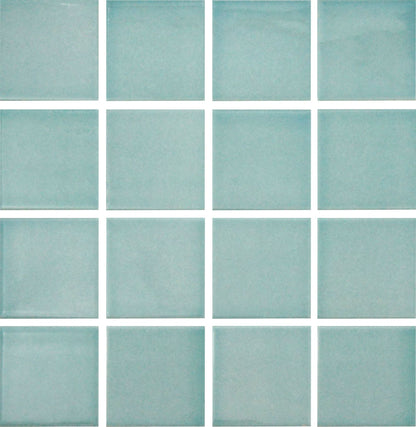A grid of square glazed porcelain tiles in a light blue color.