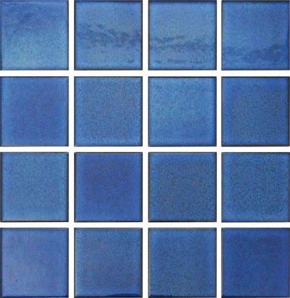 A grid of square glazed porcelain tiles in a blue color.