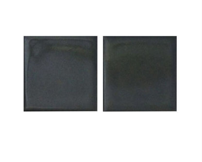 Two black square tiles on a white background