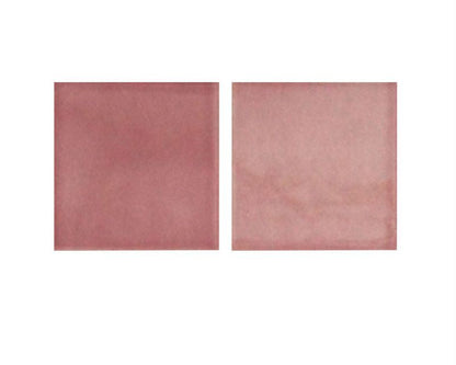 Two square tiles with a pinkish-brown color on a white background