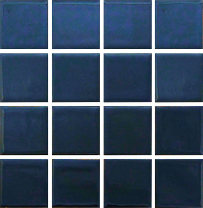 A grid of square glazed porcelain tiles in a dark blue color.