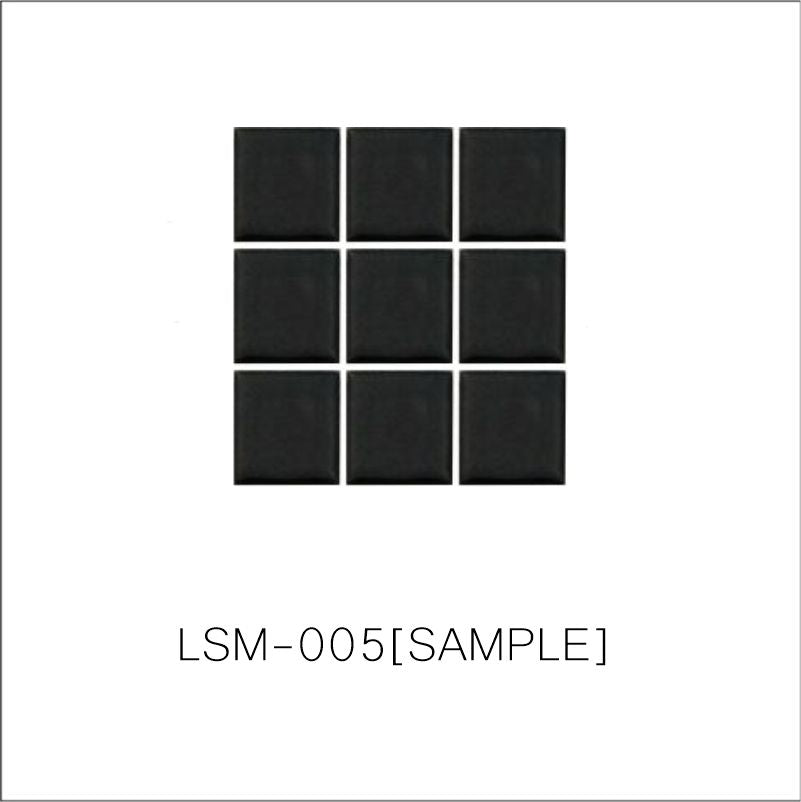 A sheet of square porcelain tiles with a glazed black finish, arranged in a mosaic pattern.