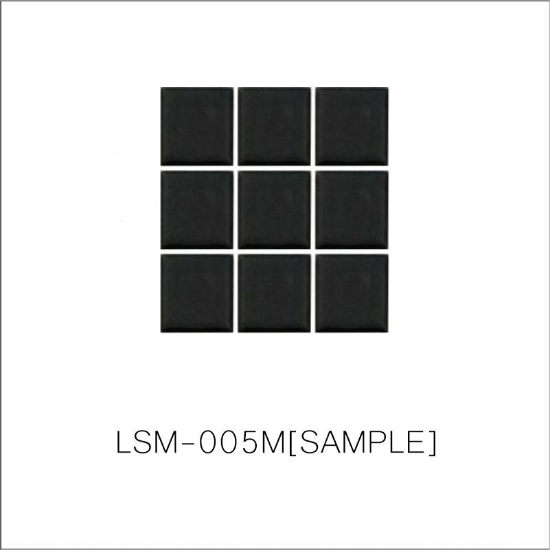 A sheet of square porcelain tiles with a glazed black  finish, arranged in a mosaic pattern.