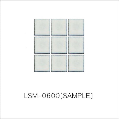 A sheet of square porcelain tiles with a glazed grey finish, arranged in a mosaic pattern.