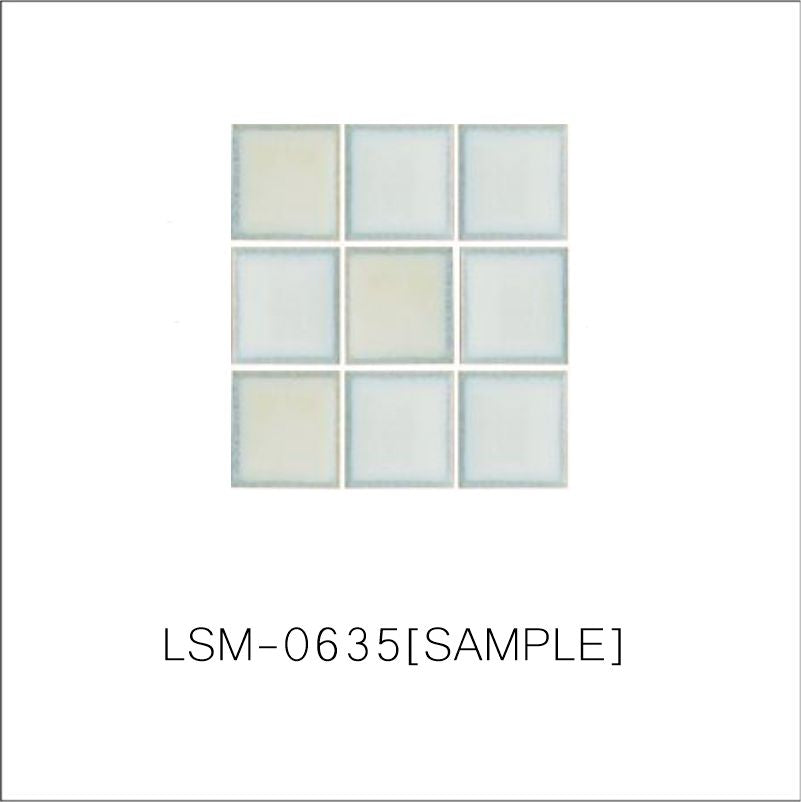 A sheet of square porcelain tiles with a glazed grey finish, arranged in a mosaic pattern.