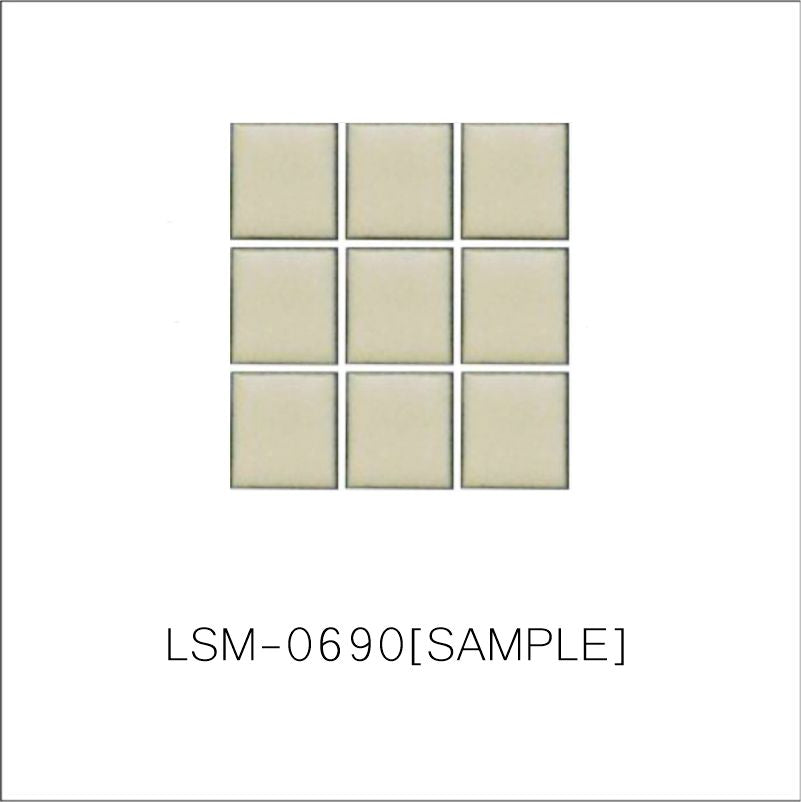 A sheet of square porcelain tiles with a yellow finish, arranged in a mosaic pattern.