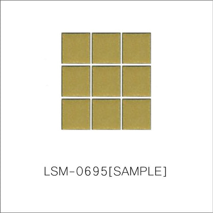 A sheet of square porcelain tiles with a glazed yellow finish, arranged in a mosaic pattern.